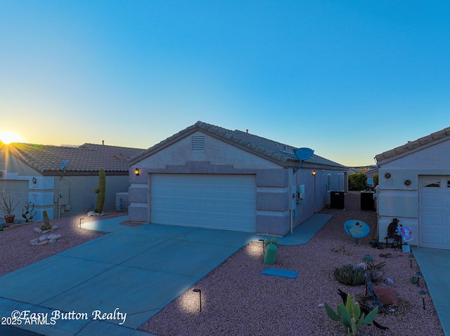 4968 E Meadow Vista Dr, Cornville, AZ 86325 - ranch-style home with a tiled roof, concrete driveway, stucco siding, cooling unit, and an outdoor structure