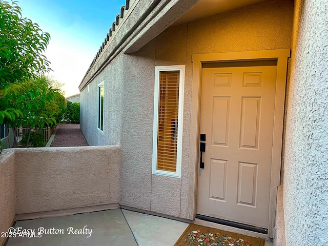 4968 E Meadow Vista Dr, Cornville, AZ 86325 - view of exterior entry with a balcony and stucco siding