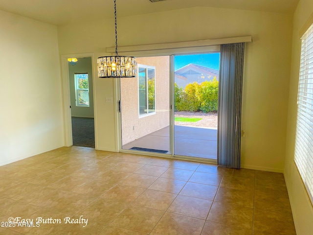 4968 E Meadow Vista Dr, Cornville, AZ 86325 - spare room featuring a chandelier, tile patterned floors, and vaulted ceiling
