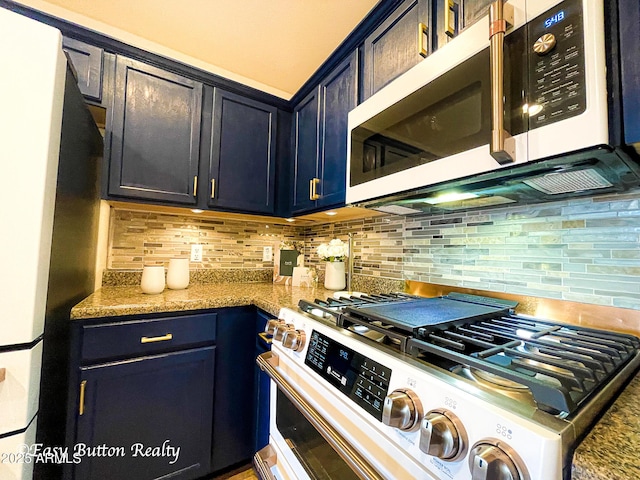 4968 E Meadow Vista Dr, Cornville, AZ 86325 - kitchen with light stone counters, decorative backsplash, and appliances with stainless steel finishes