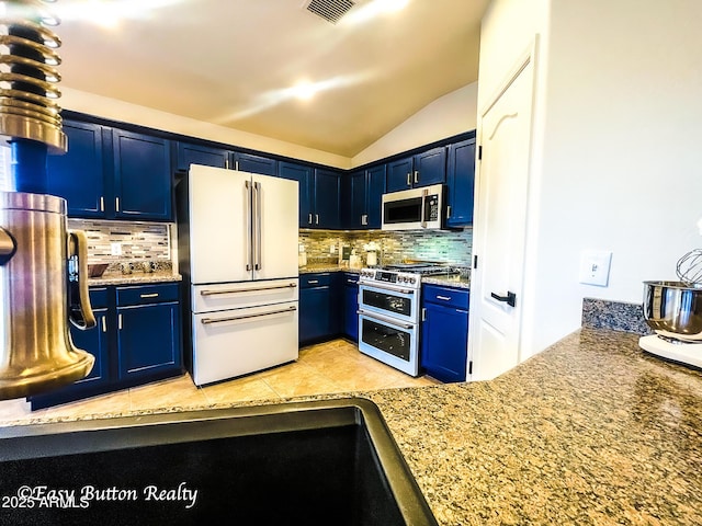 4968 E Meadow Vista Dr, Cornville, AZ 86325 - kitchen featuring tasteful backsplash, appliances with stainless steel finishes, blue cabinets, and lofted ceiling