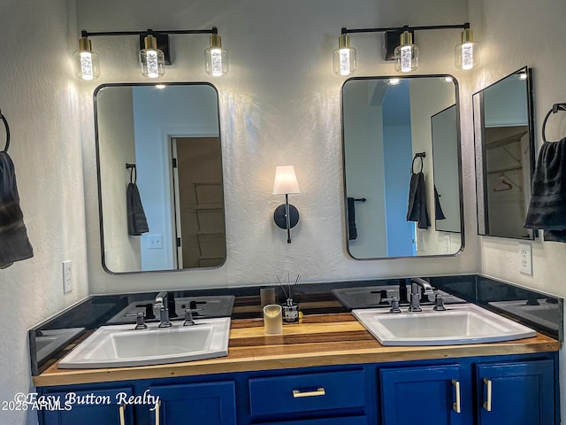 4968 E Meadow Vista Dr, Cornville, AZ 86325 - full bathroom featuring a sink, double vanity, and a textured wall