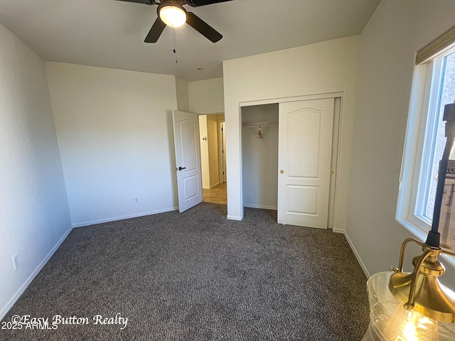 4968 E Meadow Vista Dr, Cornville, AZ 86325 - unfurnished bedroom with a closet, dark carpet, baseboards, and ceiling fan