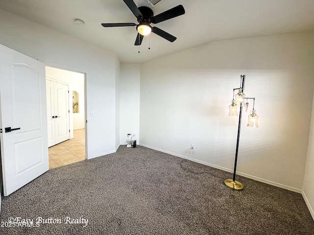 4968 E Meadow Vista Dr, Cornville, AZ 86325 - unfurnished bedroom with tile patterned flooring, baseboards, carpet, lofted ceiling, and a ceiling fan