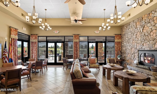 4968 E Meadow Vista Dr, Cornville, AZ 86325 - interior space featuring visible vents, ceiling fan with notable chandelier, a raised ceiling, and a high ceiling