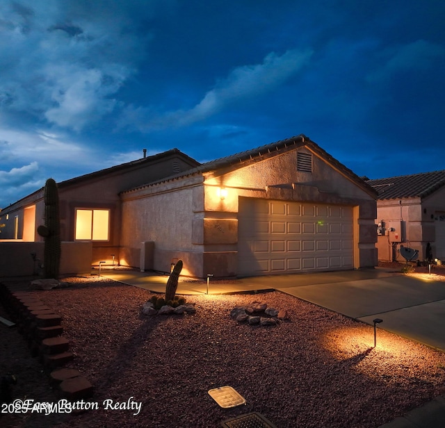 4968 E Meadow Vista Dr, Cornville, AZ 86325 - view of front of property with stucco siding, concrete driveway, an attached garage, and a tile roof