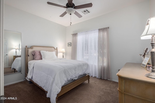 bedroom with dark carpet and ceiling fan