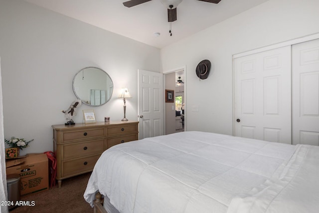 carpeted bedroom with ceiling fan and a closet