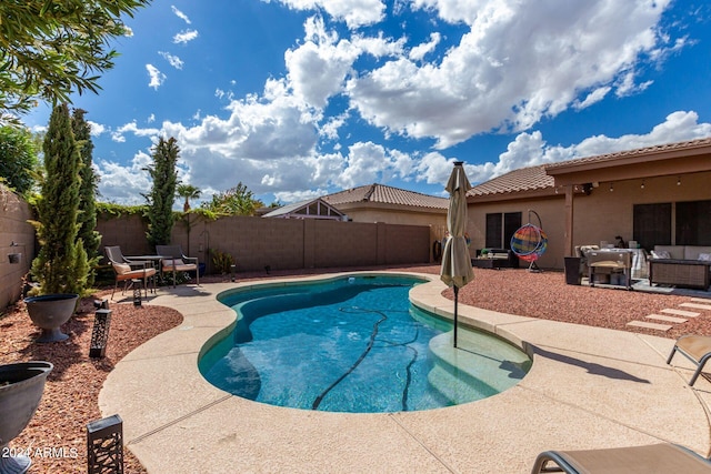 view of pool featuring outdoor lounge area and a patio area