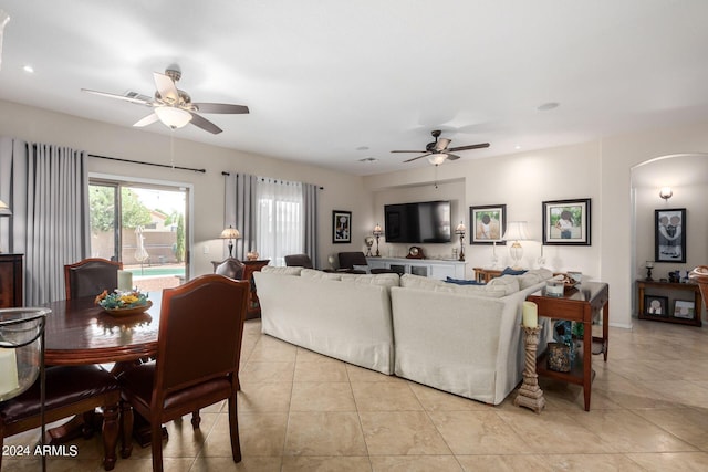 tiled living room featuring ceiling fan