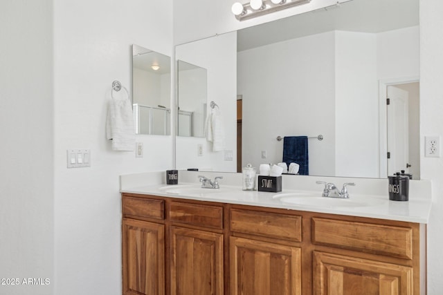 full bathroom featuring double vanity and a sink