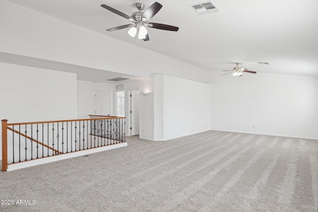 unfurnished room featuring visible vents, ceiling fan, and carpet floors