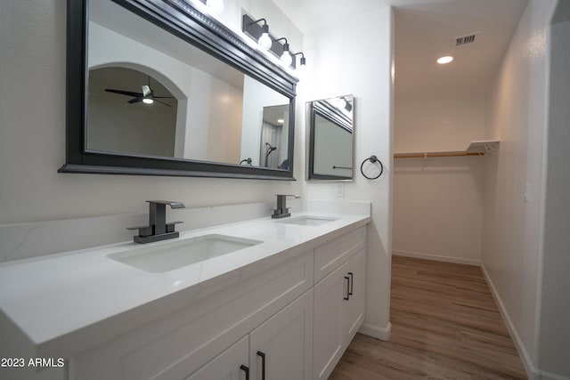 bathroom featuring ceiling fan, vanity, and hardwood / wood-style floors