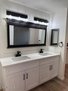 bathroom featuring vanity and hardwood / wood-style floors