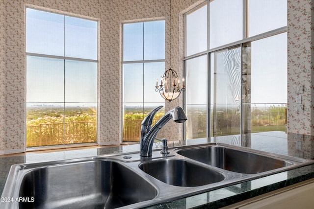 interior space featuring dark stone counters and sink