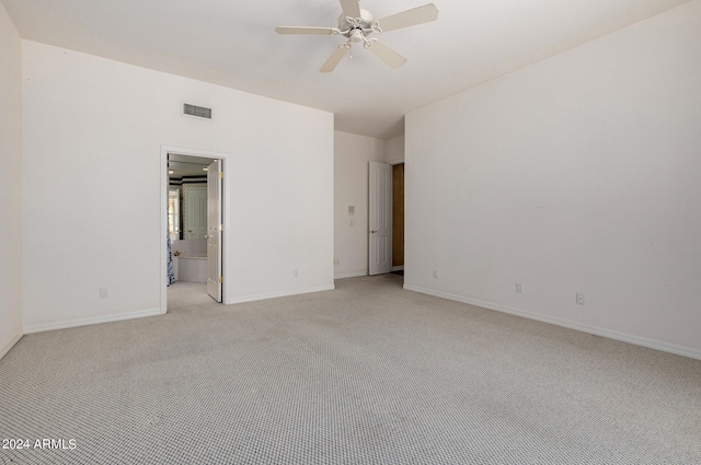 empty room with light colored carpet and ceiling fan