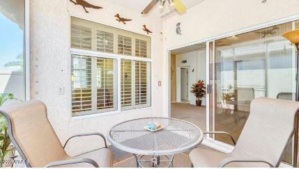 sunroom featuring ceiling fan