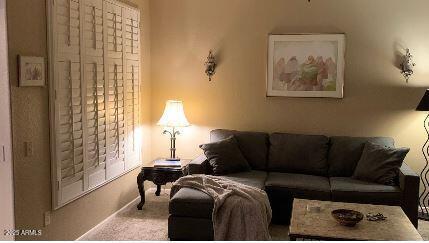 living room featuring light carpet