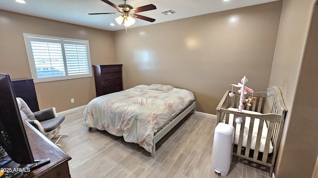 bedroom with light wood-style flooring, recessed lighting, baseboards, and visible vents