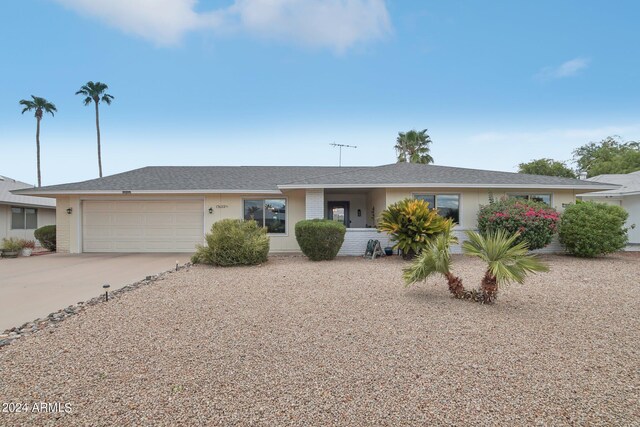 ranch-style house featuring a garage