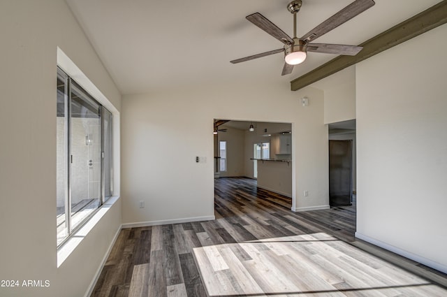 spare room with vaulted ceiling with beams, dark hardwood / wood-style floors, and ceiling fan