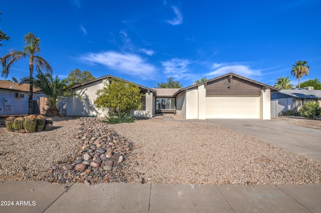 ranch-style home with a garage