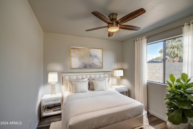 bedroom featuring dark hardwood / wood-style floors and ceiling fan