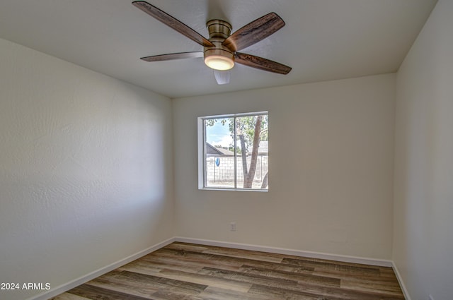 unfurnished room featuring ceiling fan and hardwood / wood-style floors