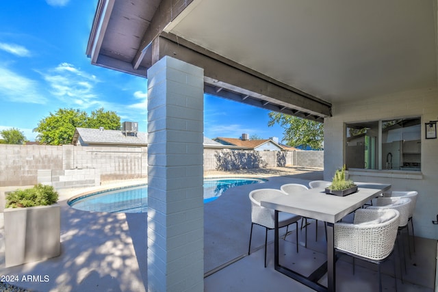 view of patio with a fenced in pool