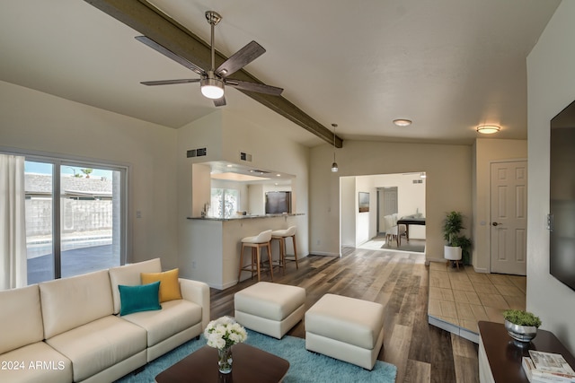 living room with ceiling fan, lofted ceiling with beams, and hardwood / wood-style floors