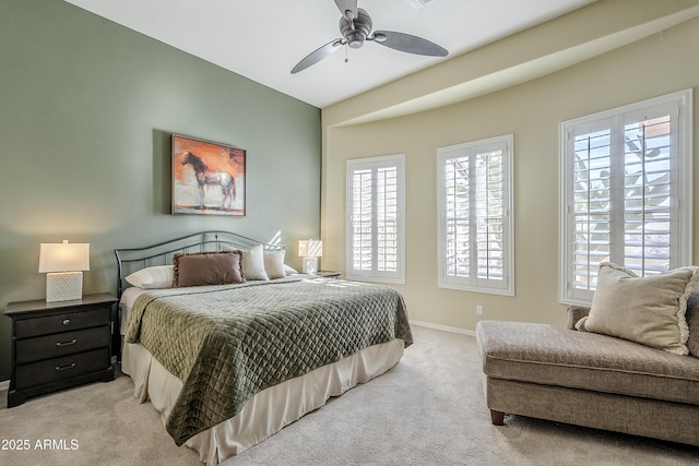 carpeted bedroom with lofted ceiling and ceiling fan