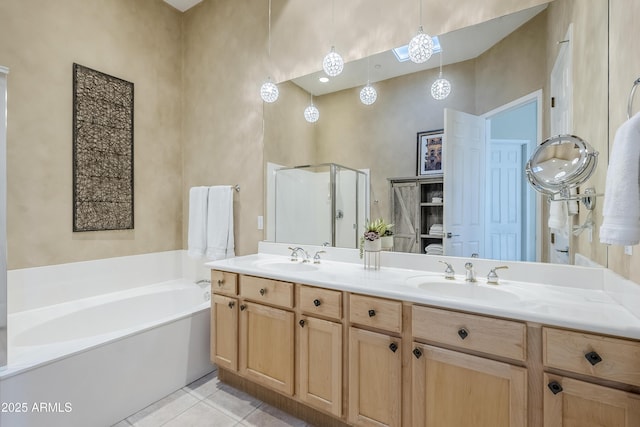 bathroom featuring independent shower and bath, vanity, a high ceiling, and tile patterned floors