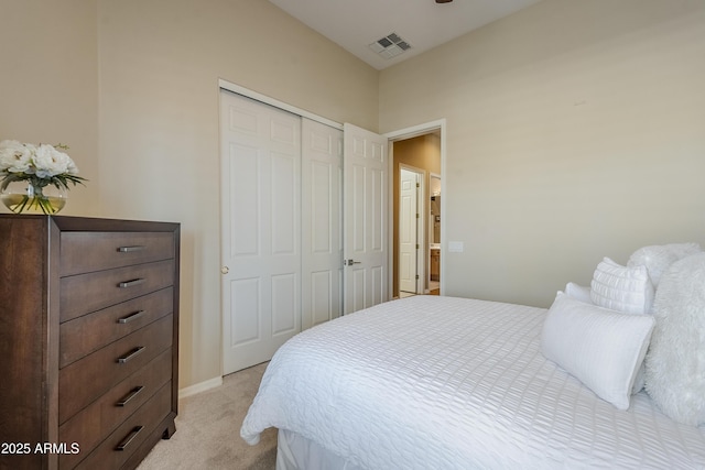 carpeted bedroom featuring a closet