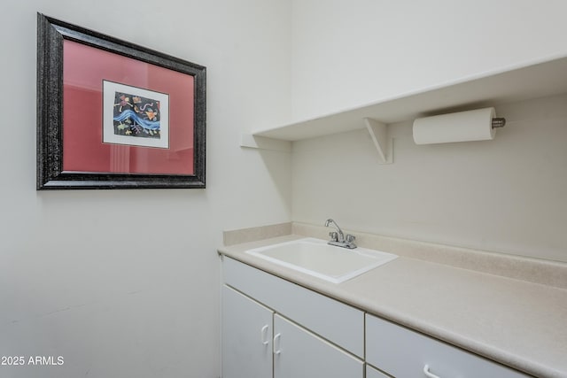 clothes washing area with sink