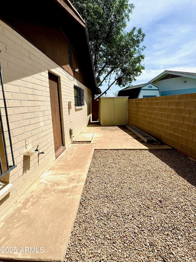 view of yard with a patio and fence