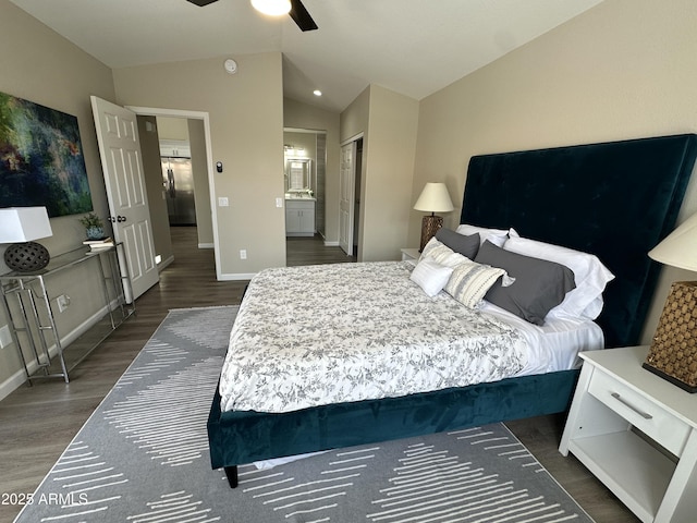 15075 W Amelia Dr, Goodyear, AZ 85395 - bedroom featuring lofted ceiling, wood finished floors, ensuite bath, and a ceiling fan