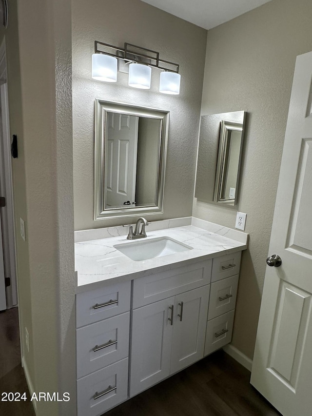 15075 W Amelia Dr, Goodyear, AZ 85395 - bathroom featuring vanity and wood finished floors