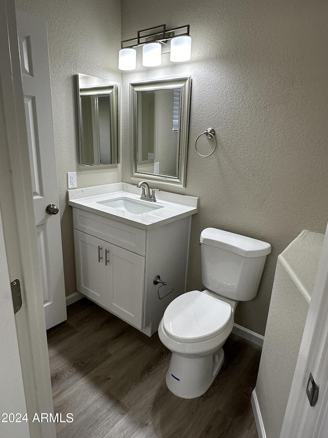 15075 W Amelia Dr, Goodyear, AZ 85395 - bathroom with wood finished floors, vanity, and a textured wall