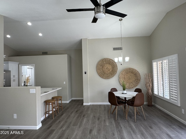 15075 W Amelia Dr, Goodyear, AZ 85395 - dining room featuring lofted ceiling, a chandelier, wood finished floors, ceiling fan, and recessed lighting