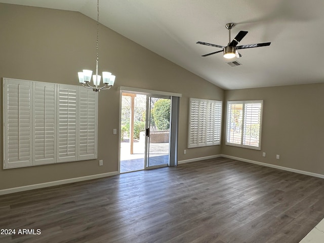 spare room featuring ceiling fan with notable chandelier, dark hardwood / wood-style flooring, and high vaulted ceiling