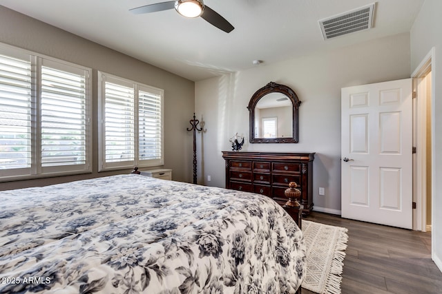 bedroom featuring dark hardwood / wood-style flooring and ceiling fan