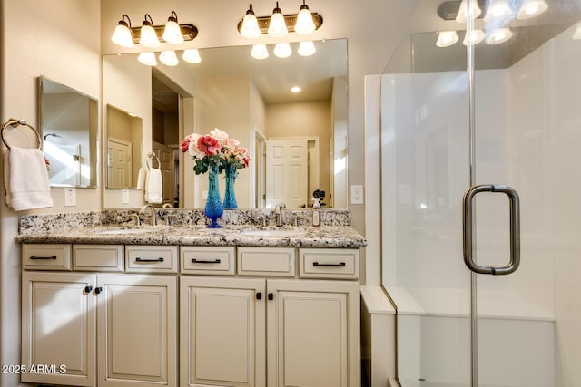 bathroom with vanity and walk in shower