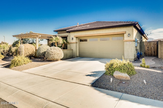 view of front of home featuring a garage and a pergola