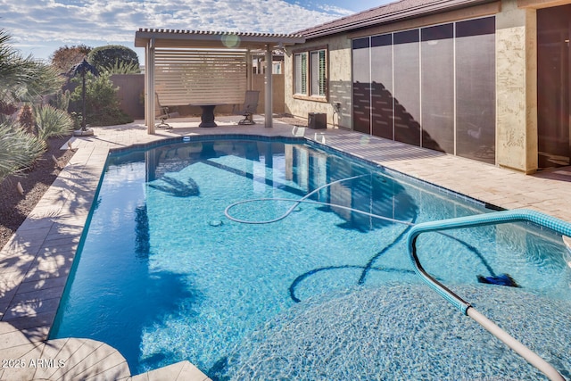 view of swimming pool featuring a patio area