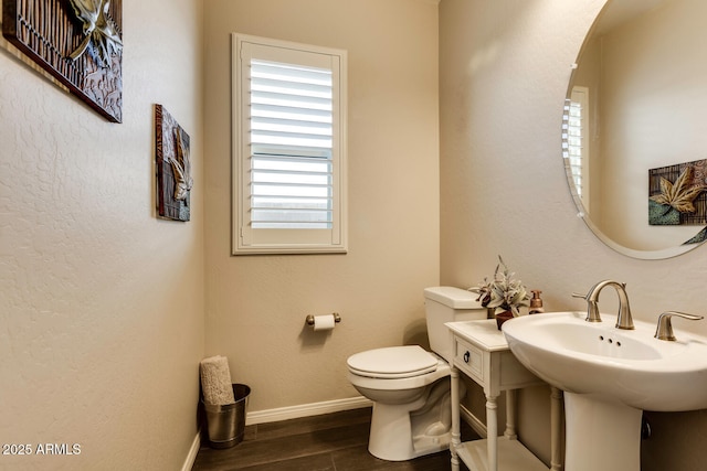 bathroom featuring toilet