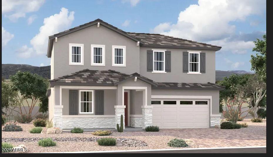 11420 S 50th Ln, Laveen, AZ 85339 - view of front of property with stucco siding, driveway, stone siding, a mountain view, and an attached garage