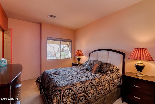 bedroom with light colored carpet