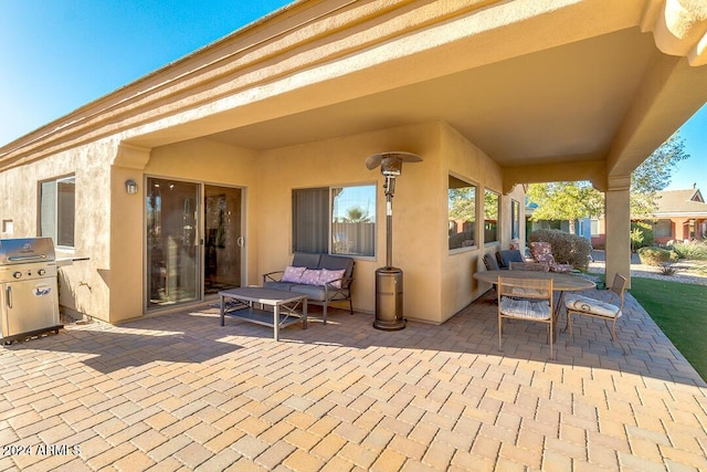 view of patio with a grill and an outdoor living space