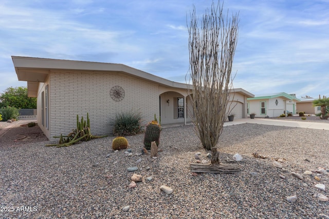 ranch-style house featuring a garage