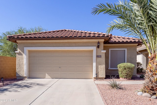 mediterranean / spanish-style home featuring a garage